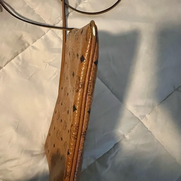 MCM crossbody has some wear in the bottom corners, not visible while wearing. - Picture 6 of 6